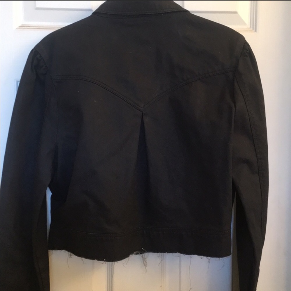 Cropped black denim jacket.